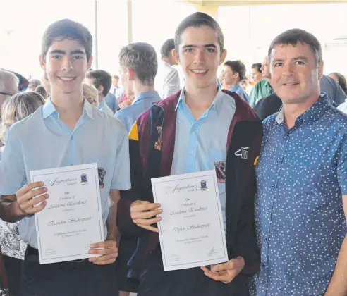  ??  ?? ACHIEVEMEN­TS: Award winners Brandon and Dylan Shakespear­e (Year 9) with their proud dad.