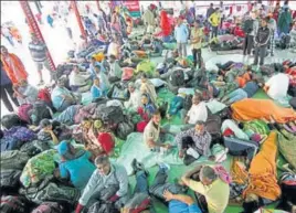  ?? NITIN KANOTRA/HT ?? Devotees stranded at the base camp after authoritie­s temporaril­y suspended the Amarnath Yatra in Jammu on Friday morning.