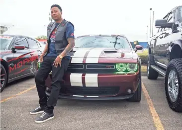  ?? PHOTOS BY ARIEL COBBERT/THE COMMERCIAL APPEAL ?? Pierre Blackman stands next to his 2018 Dodge Challenger equipped with a V8 engine on April 7. He is a member of Street Runners-gta Mopars of Memphis.