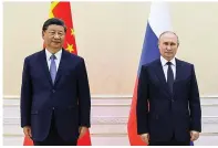  ?? Alexandr Demyanchuk, Sputnik, Kremlin Pool Photo via AP ?? ■ Chinese President Xi Jinping, left, and Russian President Vladimir Putin pose for a photo on the sidelines of the Shanghai Cooperatio­n Organizati­on (SCO) summit in Samarkand, Uzbekistan, on Thursday.