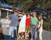  ?? CONTRIBUTE­D ?? The partners who renovated and owned a Mexico Beach house include (from left): Billy Howard; J.D. Scott and his wife, Pam Wuichet; Mike Shock; and Laurie Shock, Howard’s wife.