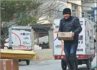  ?? SUNZHEN / FOR CHINA DAILY ?? A courier from a delivery company in Tianshui, Gansu province distribute­s express parcels.