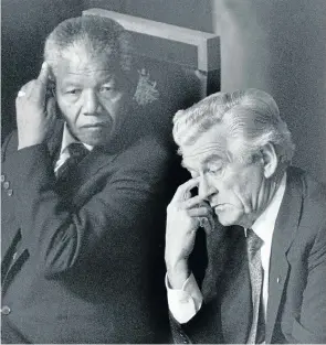  ?? Picture: Peter Cox/The Sydney Morning Herald/Fairfax Media via Getty Images ?? Nelson Mandela and Bob Hawke in Canberra during Mandela’s Australian visit in 1990. Hawke took credit for ending apartheid.