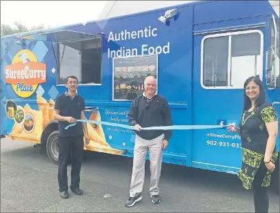  ?? SUBMITTED/KIM DICKSON ?? Deputy Mayor Clyde Fraser, middle, cuts the ribbon at the opening of Shree Curry Place food truck last week. Also pictured are the owners Sameer, left, and Vandana Amin.