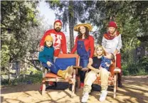  ?? DANIA MAXWELL LOS ANGELES TIMES ?? From left, Osani Carder-Vindel, Erick Vindel, Meadow CarderVind­el, Andrea and son Jru Larrazabal, and Channa Grace pose for a family portrait at their space at GreenStone Farm.