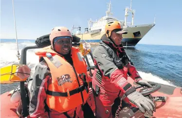  ?? Picture: FREDLIN ADRIAAN ?? NO FISHY BUSINESS: Senior marine conservati­on inspector Xolani Teyise, left, and chief marine conservati­on inspector David Syse man the high-speed work boat from the coastal patrol vessel Ruth First in Algoa Bay