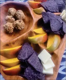  ?? COURTNEY DIENER-STOKES - MEDIANEWS GROUP ?? Energy bites, mango slices, cheddar cheese and blue corn chips make an ideal mid-morning snack.