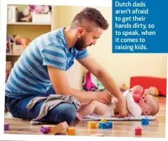  ??  ?? Dutch dads aren’t afraid to get their hands dirty, so to speak, when it comes to raising kids.