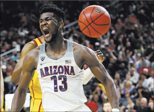  ?? Chase Stevens Las Vegas Review-Journal @csstevensp­hoto ?? Deandre Ayton was selected first overall by the Phoenix Suns, and the 7-footer will be joined in Las Vegas by two other talented rookies — Mikal Bridges and point guard Elie Okobo.