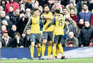  ?? PAUL ELLIS/AFP ?? Arsenal striker Olivier Giroud (second left) celebrates with teammates after scoring against Manchester United in the Premier League on Saturday.