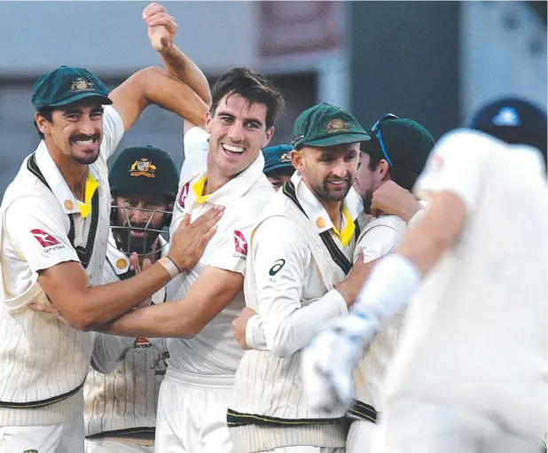  ?? Picture: AFP ?? PERFECT DELIVERY: Pat Cummins and his Aussie teammates celebrate dismissing England's Rory Burns for no runs at Old Trafford in Manchester,