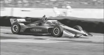  ?? ASSOCIATED PRESS ?? INDYCAR DRIVER SCOTT DIXON (9) is a blur of speed as he exits Turn 5 during the REV Group Grand Prix auto race one, Saturday in Elkhart Lake, Wis. Dixon went on to win the event.