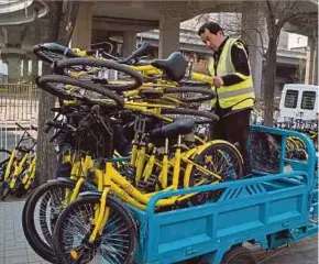  ?? AFP PIC ?? Chinese authoritie­s, are considerin­g new regulation­s to curb the bike chaos — from capping the number of bikes to even barring people they consider too big or too small for bicycles.