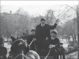  ?? KEYSTONE — GETTY IMAGES ?? From left, Ringo Starr, Paul McCartney and John Lennon of the Beatles drive a horse and carriage, during a rare break away from screaming fans, in New York's Central Park on Feb. 10, 1964.