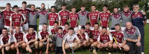  ??  ?? players and mentors celebrate after Sunday’s Junior ‘A’ championsh­ip final success in Oylegate.