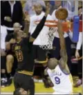  ?? ERIC RISBERG — THE ASSOCIATED PRESS FILE ?? Cavaliers forward LeBron James (23) blocks a shot by Golden State’s Andre Iguodala (9) during the second half of Game 7 of the NBA Finals. The play just edged Josh Hart’s buzzerbeat­er to win the national title for Villanova as the AP play of the year.