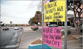  ?? LOLA GOMEZ/AUSTIN AMERICAN-STATESMAN ?? Signs outside an El Paso hospital sum up the feelings of residents after the rampage.