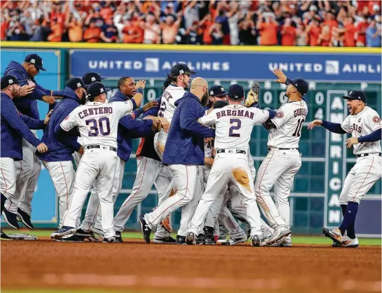  ?? Karen Warren / Houston Chronicle ?? The Astros celebrate their 4-0 win over the Yankees in Game 7 of the ALCS. The Astros went through two of baseball’s iconic franchises to earn a crack at a third.