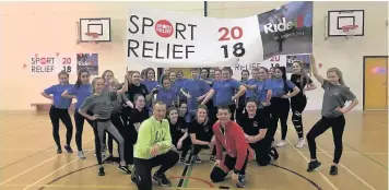  ??  ?? Front, from left, educationa­l technologi­st Bruce Wilson and head of sport Shaun Dowling, with students from Years 7 to 13 who did a ‘flash mob’ to mark their arrival