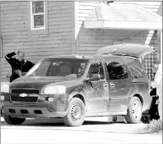  ?? — Western Star file photo ?? Investigat­ors from the RNC leave the scene June 6 of where a man was found dead in his home on Main Street in Corner Brook on Monday.