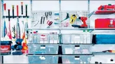  ??  ?? Organize your garage storage into categories. If there’s wall space, add storage hooks for sporting equipment, outdoor games and other items.