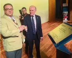  ??  ?? Vinod (left) and Prof Greenaway signing a plaque at the launch of the centre.