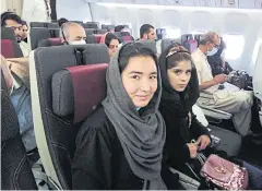  ?? NYT ?? A group of students, teachers and musicians affiliated with the Afghanista­n National Institute of Music fly out of Kabul on Sunday.