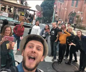  ?? COURTESY OF FILIP TODD LAZAREVSKI ?? Filip Todd Lazarevski, the founder of Free San Francisco Tour, leads a group on a free walking tour. Each walk lasts about two hours or so, and guides accept tips ($10-$15per person suggested). The tours leave from Union Square twice a day, seven days a week. The organizati­on also offers what is believed to be the first free walking tour in Spanish (available Tuesday and Thursday mornings).