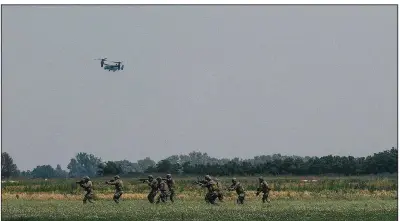  ?? The New York Times/NANNA HEITMANN ?? A U.S. V-22 Osprey flies overhead in June during maneuvers in Hungary involving Army Green Berets, Navy SEALs and NATO special forces troops as U.S. commandos team up with partners on Europe’s eastern flank to thwart Russia’s so-called hybrid warfare.