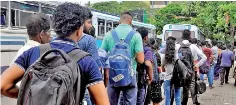  ??  ?? Long queues seen at the Pettah bus stand.
Pic by Priyantha Wickramaar­achchi