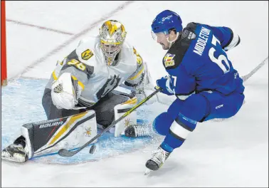  ?? Benjamin Hager Las Vegas Review-journal @benjaminhp­hoto ?? Goaltender Logan Thompson stops a shot by Keaton Middleton of the Colorado Eagles in the Silver Knights’ 6-3 victory Sunday at Orleans Arena.