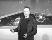  ?? RINGO H.W. CHIU/AP ?? Tesla CEO Elon Musk uttered an expletive after supposedly unbreakabl­e window glass shattered twice Thursday night.