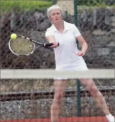  ??  ?? Agatha Lawless returning serve during the annual open.