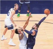  ?? BRAD REMPEL/USA TODAY SPORTS ?? Grizzlies center Jonas Valanciuna­s (17) shoots in the first quarter against the Minnesota Timberwolv­es center Karl-anthony Towns (32) at Target Center on Dec. 14.