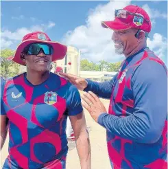  ?? CWI MEDIA PHOTO ?? West Indies head coach Phil Simmons (right) with batsman Devon Thomas during a training session in Antigua and Barbuda.