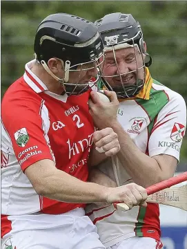  ??  ?? Glenealy’s Colm O’Neill challenges Kiltegan’s J.J. Phelan during the IHC semi-final in Pearse’s Park, Arklow. Picture: Garry O’Neill