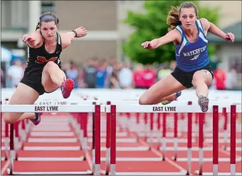  ?? SARAH GORDON/THE DAY ?? Waterford’s Sophia Podeszwa and Montville’s Lauren Ross compete in the 100-meter hurdles during last year’s ECC Championsh­ip meet at East Lyme. Ross finished second and Podeszwa was third, and both return to lead their teams this spring.