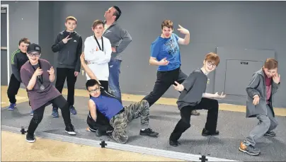  ?? NIKKI SULLIVAN/CAPE BRETON POST ?? The boys of Cape Breton dance strike a pose in the community room at the Emera Centre Northside during a break at the Danceabiti­on competitio­n on Sunday. In front, from left, are Jacob MacKinnon, 12, Drayas Darling, 9, Ryan Davis, 12, and Landon...