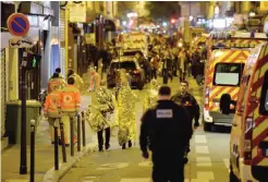  ??  ?? PARIS: This file photo taken on November 14, 2015 shows People being evacuated through rue Oberkampf near the Bataclan concert hall in central Paris, early on November 14, 2015. — AFP