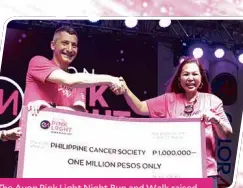  ??  ?? The Avon Pink Light Night Run and Walk raised Php1m for the Philippine Cancer Society (PCS), Avon’s long-time partner in its crusade against breast cancer. Razvan Diratian, General Manager, Avon Philippine­s hands the check to Dr. Rachael Rosario Executive Director, Philippine Cancer Society