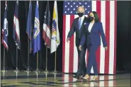  ?? CAROLYN KASTER - THE ASSOCIATED PRESS ?? Democratic presidenti­al candidate former Vice President Joe Biden and his running mate Sen. Kamala Harris, D-Calif., arrive to speak at a news conference at Alexis Dupont High School in Wilmington, Del., Wednesday, Aug., 12,