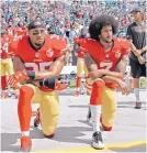  ?? AP FILE ?? Eric Reid, left, and Colin Kaepernick kneel during the national anthem in 2016 while with the San Francisco 49ers.