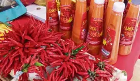  ?? JULIE S. ALIPALA/INQUIRER MINDANAO ?? RED HOT SPICE Don’t be turned off by the label Hot Moro on the bottled product shown above. The chili product is in demand in TawiTawi and Sabah—without which a meal isn’t complete.