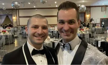  ?? Patricia Sheridan/Post Gazette ?? Brennen Wagner-Malia, left, and his husband, John Wagner-Malia, at the Gala of Giving to benefit at Seven Springs Mountain Resort.