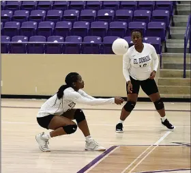 ?? Penny Chanler/Special to News-Times ?? Dig it: El Dorado's Kalea Moseby bumps the ball up for her teammates as Kamya Bryant anticipate­s the play. The Lady Wildcats fell to Little Rock Central 3-0 Monday night at Wildcat Arena.