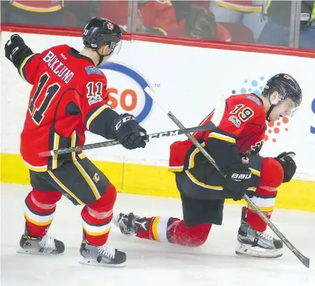  ?? JIM WELLS ?? Matthew Tkachuk celebrates after scoring against the Detroit Red Wings on Friday night at the Scotiabank Saddledome. Tkachuk’s first-period tally gave the Flames a 2-1 lead that held up until the Wings scored with two seconds left. Mikael Backlund...