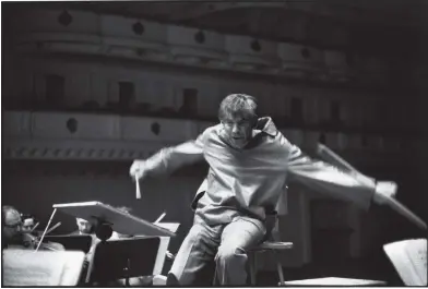  ??  ?? Leonard Bernstein conducting the New York Philharmon­ic at Carnegie Hall, 1960; photograph by Henri Cartier-Bresson