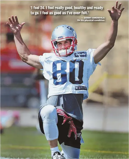  ?? STAFF PHOTO BY NANCY LANE ?? IT’S A REACH: Receiver Danny Amendola stretches at the start of yesterday’s practice in Foxboro.