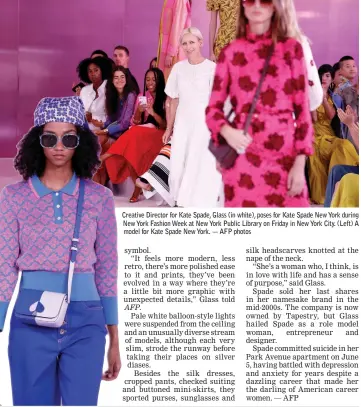  ??  ?? Creative Director for Kate Spade, Glass (in white), poses for Kate Spade New York during New York Fashion Week at New York Public Library on Friday in New York City. (Left) A model for Kate Spade New York. — AFP photos