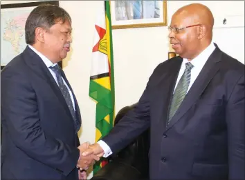  ??  ?? Speaker of the National Assembly Advocate Jacob Mudenda welcomes Indonesian Ambassador to Zimbabwe Mr Stephanus Yuwono in Harare yesterday. — (Picture by John Manzongo)